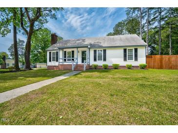 Charming single-story home featuring a welcoming front porch, brick foundation, and a well-manicured lawn at 1100 Brandywine Ln, Rocky Mount, NC 27804