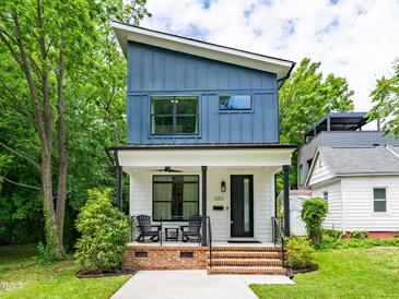 Modern two-story home features a charming front porch and blue and white siding at 1202 S Bloodworth St, Raleigh, NC 27601