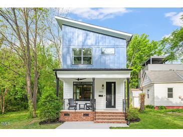 Charming two-story home with blue siding and modern design at 1202 S Bloodworth St, Raleigh, NC 27601