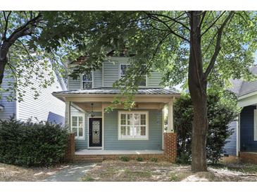 Charming home with a covered front porch and beautiful landscaping at 2157 Dunn Rd, Raleigh, NC 27614