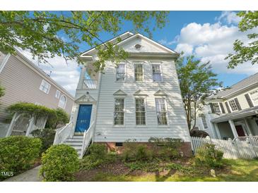 Charming two-story home with white siding, a blue front door, and well-maintained landscaping at 403 Brookgreen Dr, Chapel Hill, NC 27516