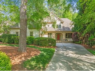Beautiful two-story home featuring a welcoming front porch and well-maintained landscaping at 19002 Stone Brk, Chapel Hill, NC 27517