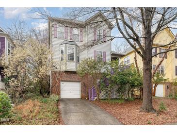 Charming home with purple shutters and a one-car garage and driveway at 244 Sweet Bay Pl, Carrboro, NC 27510