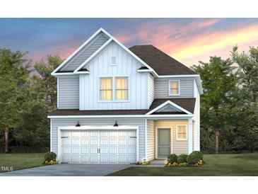 Charming two-story home with a two-car garage, green lawn and beautiful architectural details at 3231 Pelican Ln, Durham, NC 27703