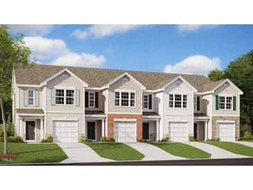 Charming townhome community showcasing craftsman-style architecture and professionally landscaped surroundings at 404 Ember St, Sanford, NC 27330