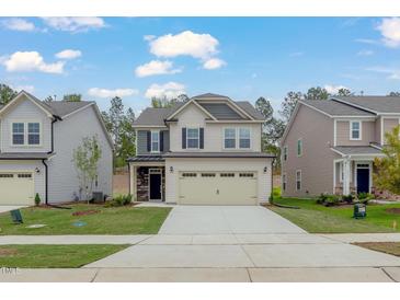 Charming two-story home with a two-car garage and well-maintained lawn at 2007 Seford Dr, Durham, NC 27703