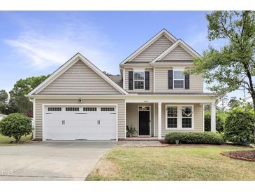 Charming two-story home with a two-car garage, well-maintained lawn, and traditional architectural details at 4405 Aubaun Way, Knightdale, NC 27545
