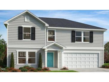 Charming two-story home features a gray exterior, black shutters, manicured landscaping, and a two-car garage at 91 Gobbler Dr, Smithfield, NC 27577