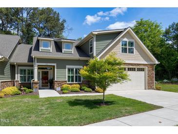 Charming single-Gathering home with a two-car garage and well-manicured landscaping, offering curb appeal and a welcoming entrance at 199 Telluride Trl, Garner, NC 27529
