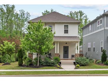 Charming two-story home with a landscaped yard and inviting front porch at 563 Great Ridge Parkway, Chapel Hill, NC 27516