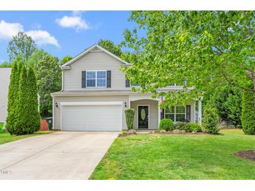 Charming two-story home featuring a two-car garage, well-maintained lawn, and traditional siding at 1307 Torrey Pines Ct, Mebane, NC 27302