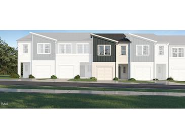 New construction townhome featuring gray and white exterior with an attached garage at 3010 Vitner Dr, Durham, NC 27704