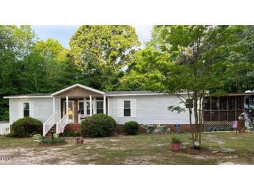 Charming single-story home with well-maintained lawn, cozy porch, and traditional curb appeal at 6237 Nc 96 Hwy W, Youngsville, NC 27596