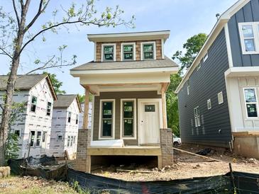 New construction home with white trim and light brown siding at 901 Linwood Ave, Durham, NC 27701