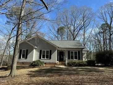 Charming one-story home with gray siding and a well-maintained front yard at 110 Woodland Ridge Dr, Fuquay Varina, NC 27526
