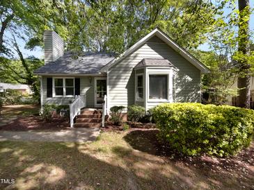 Charming single-story home with a well-manicured lawn, brick walkway, and inviting front entrance at 6005 Antigua, Knightdale, NC 27545