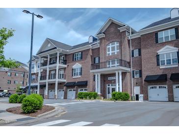 Elegant brick building with private garages and balconies offers sophisticated living at 800 Gathering Park Cir # 204, Cary, NC 27519