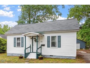 Charming single-story home featuring a welcoming front porch and well-maintained landscaping at 820 Southern St, Selma, NC 27576