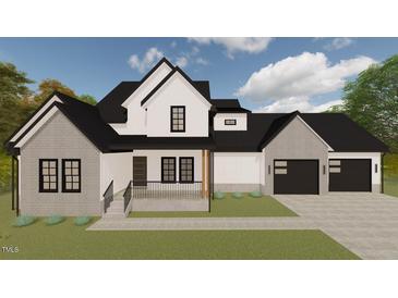 Striking two-story home features a charming front porch and a two-car garage at 123-125 Ottawa Dr., Louisburg, NC 27549