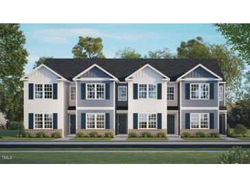 Beautiful new construction townhomes with charming curb appeal and traditional architectural details at 184 Holmes Corner Dr, Smithfield, NC 27577