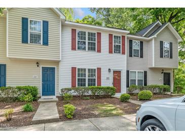 Charming townhouse exterior with colorful shutters and well-maintained landscaping at 2253 Violet Bluff Ct, Raleigh, NC 27610
