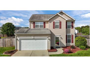 Charming two-story home with red shutters, well-maintained lawn, and attached two-car garage at 2503 Macdougall Dr, Burlington, NC 27217