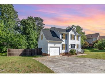 Two-story home features a driveway and attached one car garage at 2708 Tryon Pines Dr, Raleigh, NC 27603