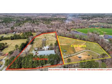 Aerial view of two properties with acreage outlined in red and yellow on a wooded lot at 754 Epps Clark Rd, Siler City, NC 27344