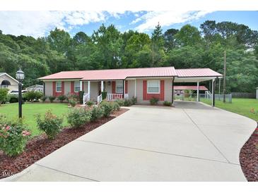 Charming single-story home with a manicured front yard and a long driveway at 113 Gulf Drive Dr, Dunn, NC 28334