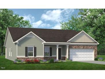 Charming single-story home featuring a mix of siding and brick with an attached two-car garage at 1234 Pioneer Lot 3 Dr, Sanford, NC 27330