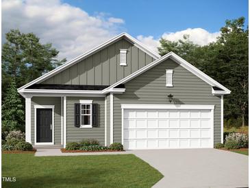 Charming single-Gathering home boasts a manicured lawn, grey siding, and a two-car garage, blending comfort with curb appeal at 280 Babbling Brook Dr, Clayton, NC 27520