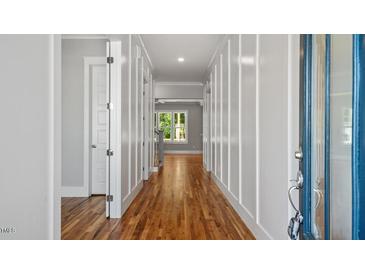 Inviting entryway with hardwood floors, white trim, and natural light streaming through the front door and into the home at 1733 Birdhaven Ln # 2217, Wendell, NC 27591