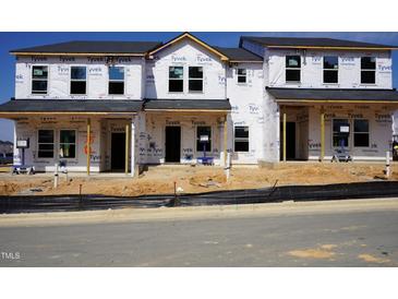 New construction townhomes featuring modern architecture and quality Tyvek HomeWrap for energy efficiency at 3712 Rosebush Dr, Zebulon, NC 27597