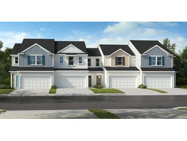 Charming townhomes featuring varied siding and individual garages, perfect for modern living at 518 Sunset Lake St, Durham, NC 27704