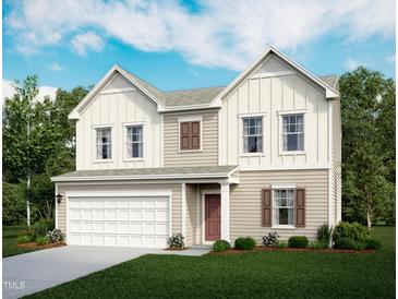 Charming two-story home featuring a two-car garage, beautifully landscaped yard and craftsman style architecture at 944 Bombardier Ln, Spring Hope, NC 27882