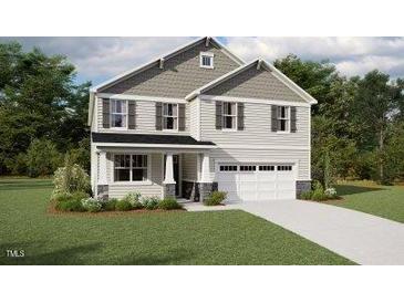 Charming two-story home featuring a two-car garage, neutral color palette, and manicured lawn at 172 Sprenger St, Garner, NC 27529