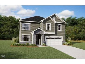 Charming two-story home featuring a well-manicured lawn and an attached two-car garage at 192 Sargents St, Garner, NC 27529