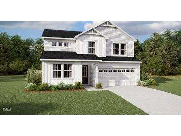 Charming two-story home with white siding, black roof, and well-manicured lawn at 225 Sprenger St, Garner, NC 27529