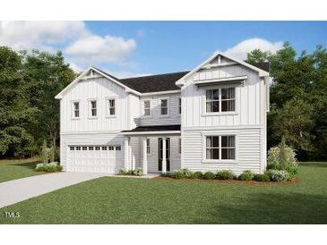Charming two-story white home with a two car garage, landscaped lawn, and beautiful architectural details at 191 Yellow River Way, Garner, NC 27529
