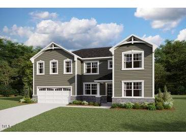 Charming two-story home featuring a two-car garage, well-manicured lawn, and inviting curb appeal at 203 Yellow River Way, Garner, NC 27529