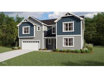 New construction two-story home with a two-car garage, neutral siding, and well-manicured front lawn at 211 Yellow River Way, Garner, NC 27529