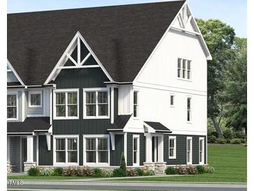 New construction two story townhouse with a modern dark gray and white facade and detailed architectural features at 3018 White Rail Dr, Fuquay Varina, NC 27526
