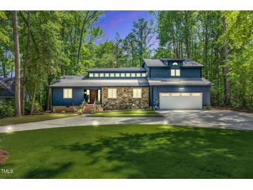 Gorgeous home with well-kept lawn, bright two-car garage, and unique window features at 106 Silverwood Ln, Cary, NC 27518