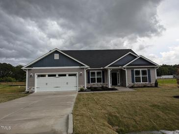 Charming single-story home with a two-car garage, landscaped yard, and inviting curb appeal at 1590 Pecan Drive # 45, Nashville, NC 27856