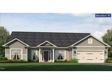 Charming single-story home featuring a covered entrance, gray siding, and a two-car garage at 1640 Pecan Drive # 44, Nashville, NC 27856