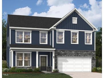 Charming two-story home with blue siding, stone accents, and white trim details at 215 Macon Lake Drive # 23, Apex, NC 27523