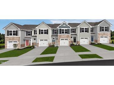 New townhomes featuring eye-catching exteriors, attached garages, manicured lawns, and modern design at 252 Elyse Overlook Loop, Sanford, NC 27332