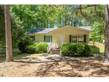 Charming single-story home with a cozy front porch and well-maintained landscaping at 145 Mark St, Franklinton, NC 27525