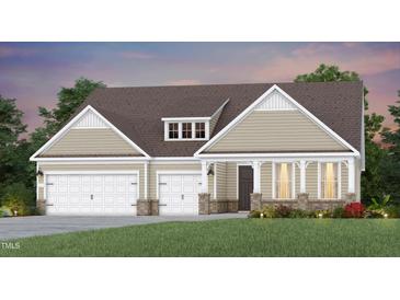 Charming single-Gathering home with a two-car garage, a front porch, and a well-manicured lawn at 2505 Del Webb Gardens Dr, Fuquay Varina, NC 27526