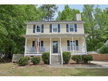Charming two-story home with a welcoming front porch and neatly landscaped yard at 300 Hutchins Dr, Garner, NC 27529